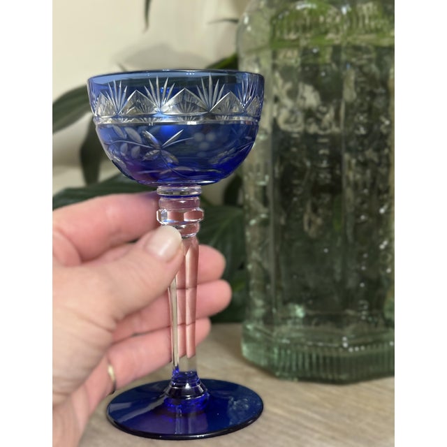 This vibrant set of four cobalt cut-to-clear stemware glasses is ideal for cordials, liqueurs, or tasting pours. Made in...
