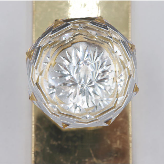 Modern style dummy door knob made of a clear faceted glass knob with a plain polished brass plate. The original mounting...