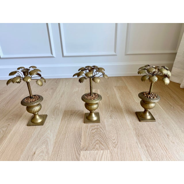 Rare matched set of three vintage brass palm tree candlesticks, dating to the 1970s. This sculptural trio features finely...
