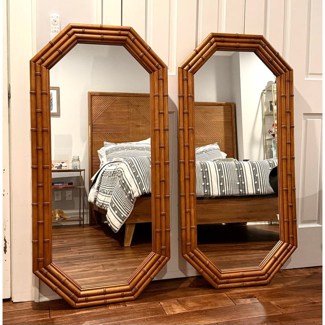 A striking pair of vintage faux‑bamboo octagonal mirrors, produced with mirror components by Lenoir Mirror Co. (backstamp...