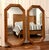 A striking pair of vintage faux‑bamboo octagonal mirrors, produced with mirror components by Lenoir Mirror Co. (backstamp...