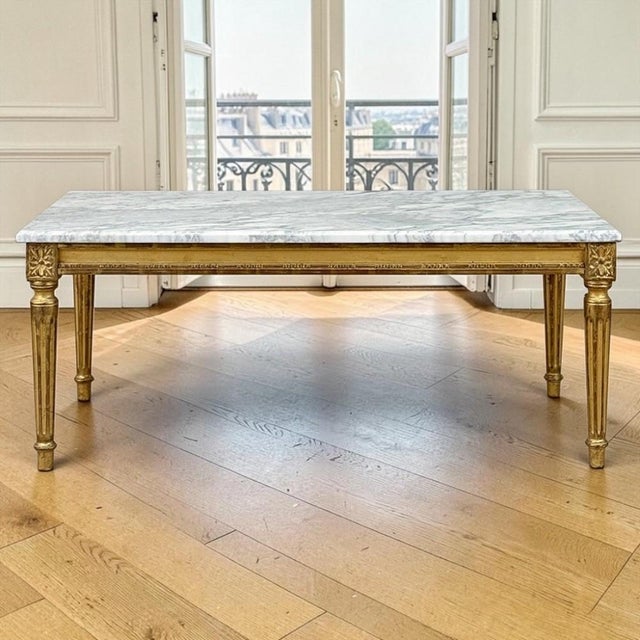 The timeless elegance of Louis XVI neoclassicism is beautifully expressed in this French giltwood coffee table, crowned...