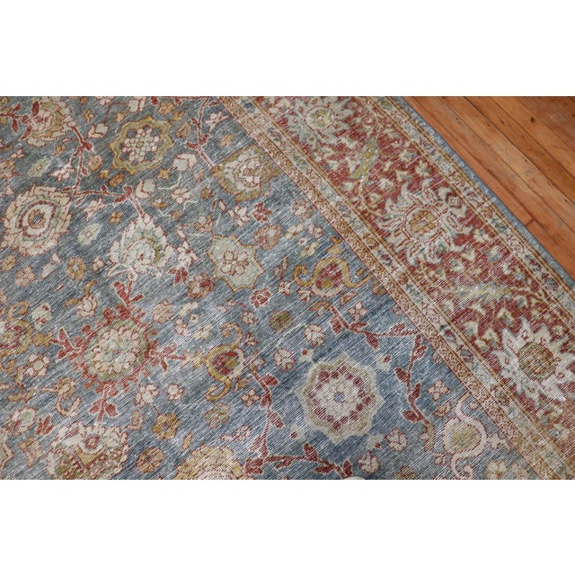 An early 20th century Persian Mahal evenly worn Room size rug in rustic tones