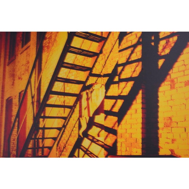 Alleys & Fire Escapes #55, This Blessed Light (1999, Toronto) by Xavier Nuez captures a quiet yet powerful moment where...