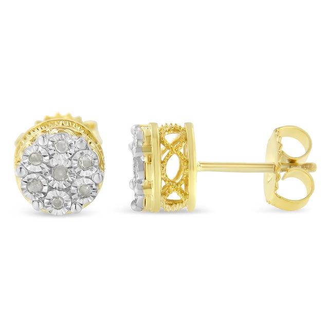 These striking cluster diamond earrings are made in 14k yellow gold plated sterling silver and feature 1/7ct TDW of promo...
