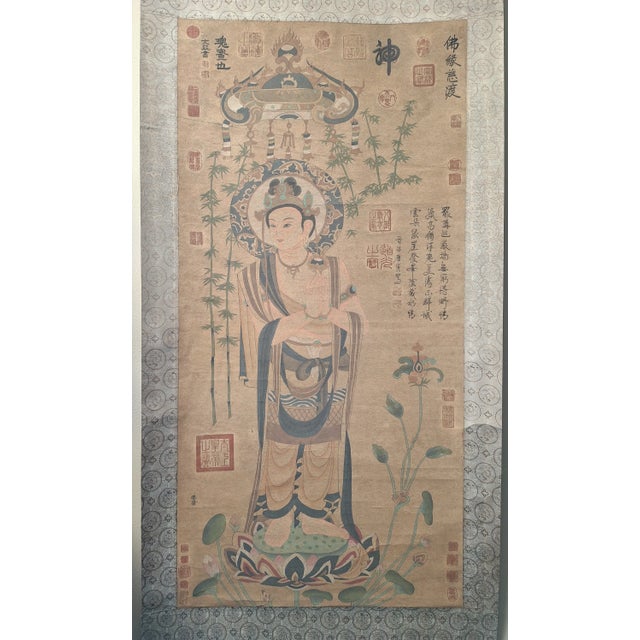 Chinese standing Kuanyin scroll, colored inks on heavy paper, mounted on a shimmering dark copper, grey and light blue,...