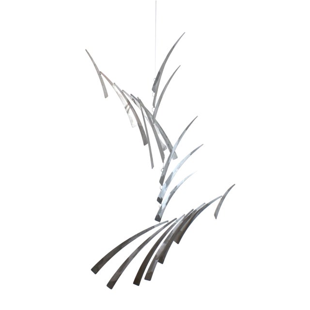 Fabulous and eye-catching large mobile sculpture. Composed of three tiers of elongated brushed aluminum pieces, resembling...