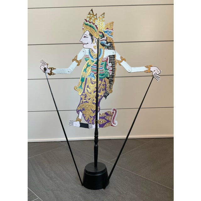 This is an exquisitely-handcrafted traditional Indonesian Wayang Kulit shadow puppet. Made of leather, the puppet is...