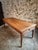 This antique French farmhouse dining table dates from the late 19th century (circa 1850–1900). The table features a solid...