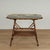 Lofty 19th century English table crafted in burnt bamboo grasscloth on two tiers, featuring a later decoupage tropical...