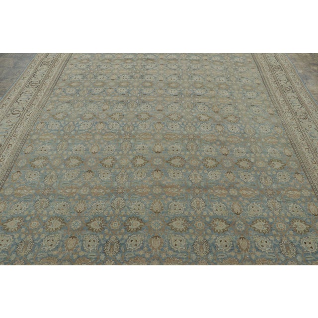 Hand-knotted in fine wool, this 9x13 antique Persian Tabriz rug, circa 1900–1920, is a standout piece in Rug & Kilim’s...