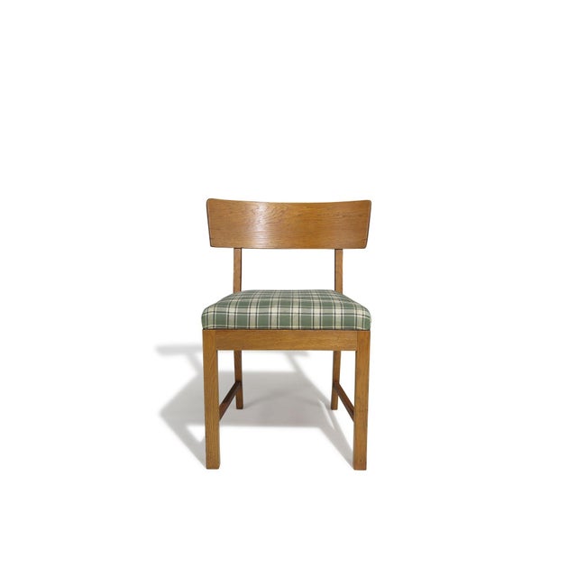 A pair of traditional Scandinavian side chairs, handcrafted in white oak by cabinetmaker Rud. Rasmussen, Denmark, circa...