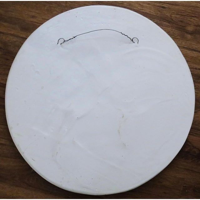 FREE SHIPPING ANYWHERE I N THE CONTINENTAL US! This is a vintage round white mirror featuring rabbits in various poses and...