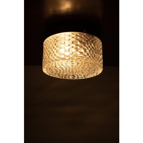 Ceiling/wall lamp from Germany. Wonderful sleek model with a geometrical pattern made of glass with metal holder. This...