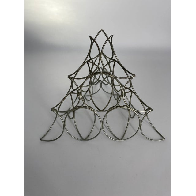 Mid Century geometric sculpture on offer, made of many 3D crescent moon shapes that form an overall pyramid. Makers mark...