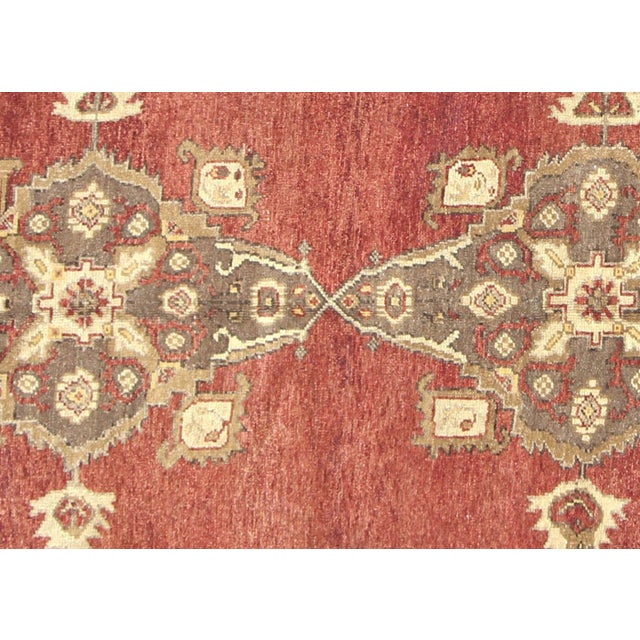 Handwoven Turkish Oushak rug in wool, measuring 4'10" x 12'8". Features the region's characteristic bold geometric...