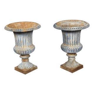 Pair of Turn of the Century French Medici Urn Cast Iron Planters with Patina For Sale