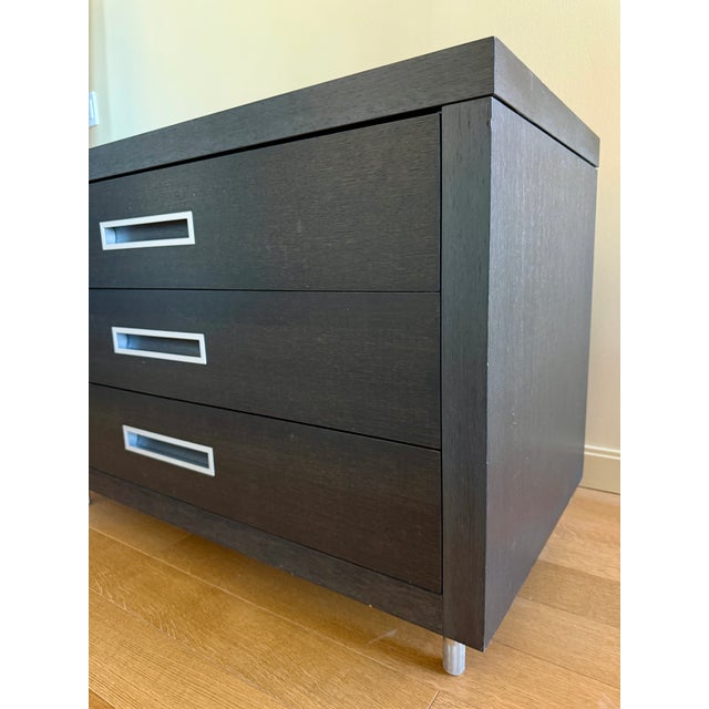 A modern classic - grey wood chest of 3 drawers 2 wheels on 1 side, with 'sliding top' (not fully functional to slide, but...