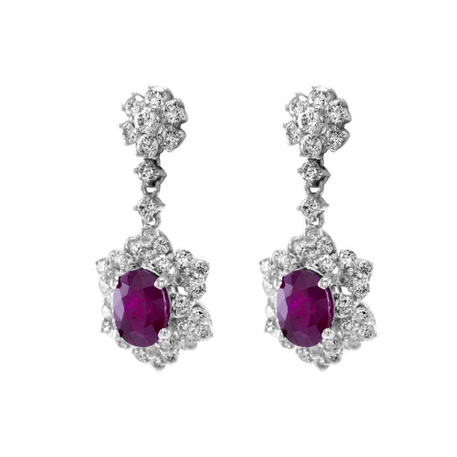 Beautiful natural oval Burmese ruby and diamond drop earrings. 3.84 carats total gemstone weight. 2 oval Burmese rubies,...