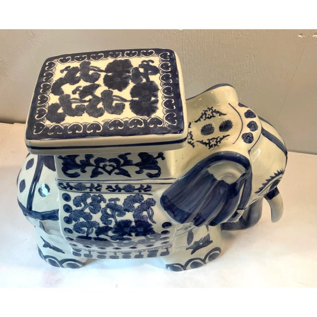 Love this elephant shaped blue and white ceramic garden plant stand!