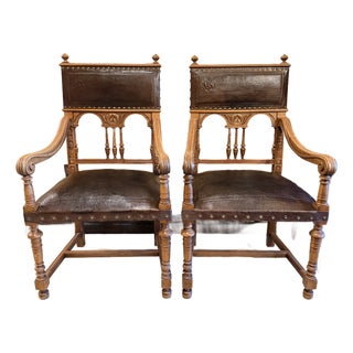 Vintage Renaissance Revival Carved Wood and Embossed Leather Armchairs – A Pair For Sale