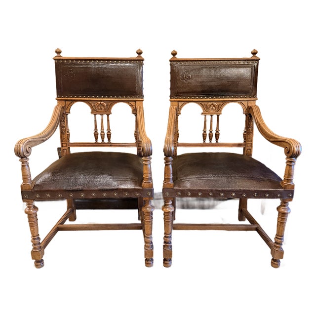 Vintage Renaissance Revival Carved Wood and Embossed Leather Armchairs – A Pair For Sale