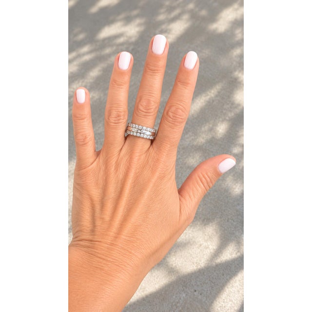 This is one of those rings that’s just easy to wear. Two rows of bright white diamonds run along the top and bottom, with...