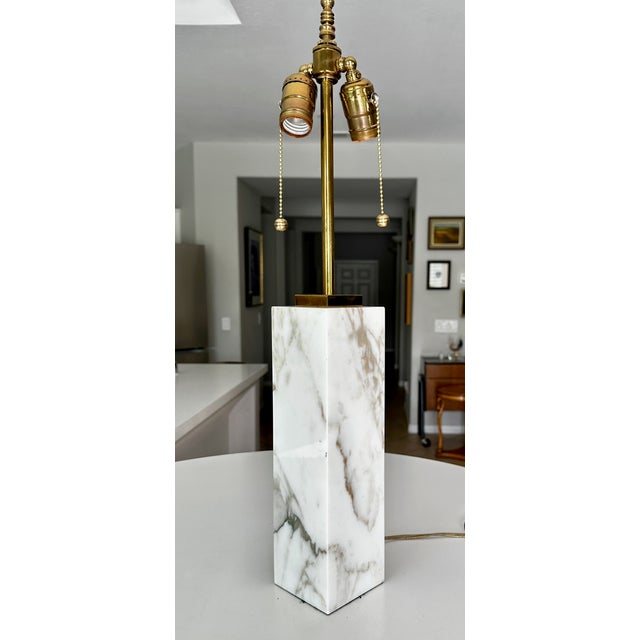 Single T.H. Robsjohn-Gibbings for Hansen Table Lamp with white marble base and brass fittings including double pull chain...