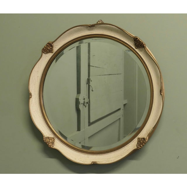 French Round Art Deco Wall Mirror in Gilt and Cream This very attractive Mirror has a 1” wide cream crackle painted and...