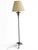 An impressive Romanesque Revival floor lamp dating from the 1950s, crafted from solid bronze and finished with a rich...