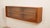 This vintage hanging sideboard is crafted from warm-colored teak wood. The piece features two glass sliding doors with...