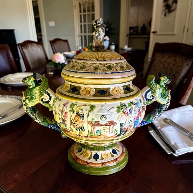 Vintage German Majolica Style Covered Tureen With Gnomes and Wing Gryphon Handles. This decorative covered tureen combines...