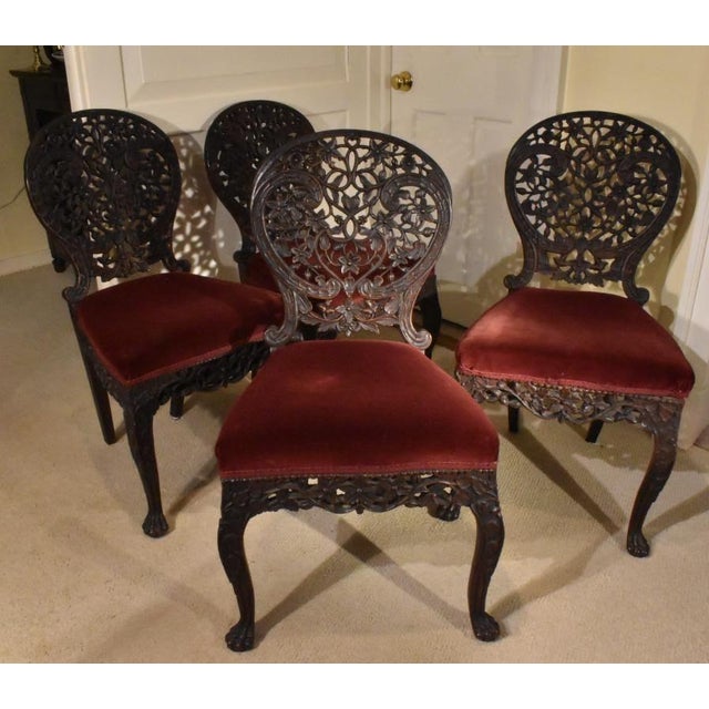Set of four Anglo Indian rosewood carved side chairs of exceptional workmanship and still retaining old, and probably, the...