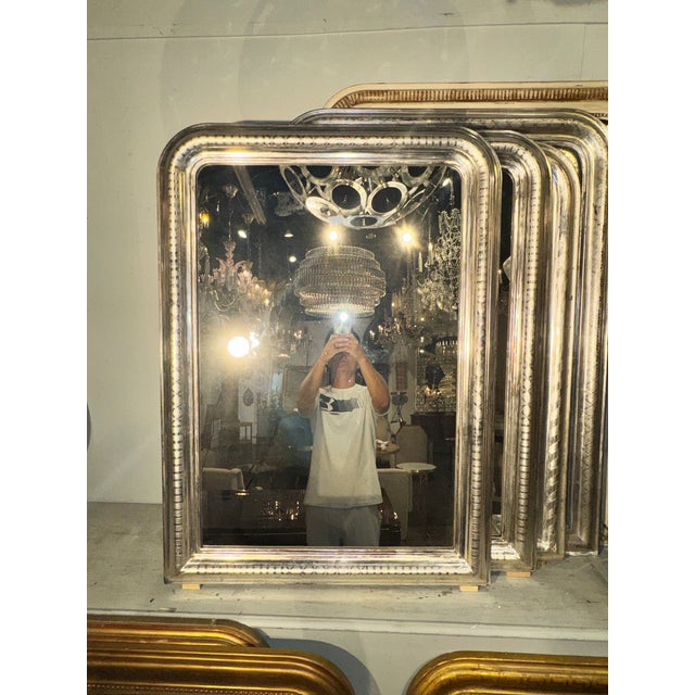 This product is a pair of French Silver Louis Philippe Geometric Pattern Mirrors, perfect for adding a touch of elegance...