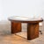 An elegant Art Deco style desk in burr walnut dating from the 1950s, remarkable for its clean lines and rounded shapes...