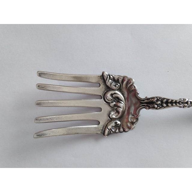 This five-tine fork is from the Victorian Era, made of sterling silver. The pattern is Dresden by Whiting Sterling. Marked...