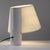 Italian-made lamp from the 1960s, consisting of a cylindrical body in white lacquered metal and a truncated cone-shaped...