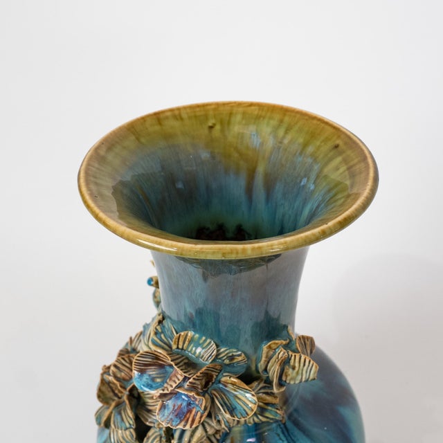 A striking pair of handcrafted Indonesian ceramic vases, dating to circa 1970, featuring richly textured surfaces with...