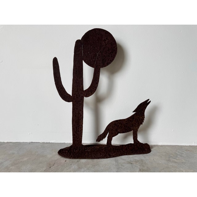 This striking vintage metal sculpture captures the essence of the American Southwest with its bold, rustic depiction of a...