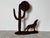 This striking vintage metal sculpture captures the essence of the American Southwest with its bold, rustic depiction of a...