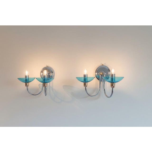 These beautiful pair of wall lights have 2 lamps on each with lovely aquamarine blue Murano glass cups, typical of the...
