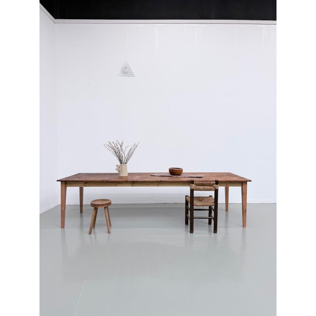 Antique solid pine farmhouse table from the 1950s, measuring a generous 3 meters. We love its typical farmhouse look, with...