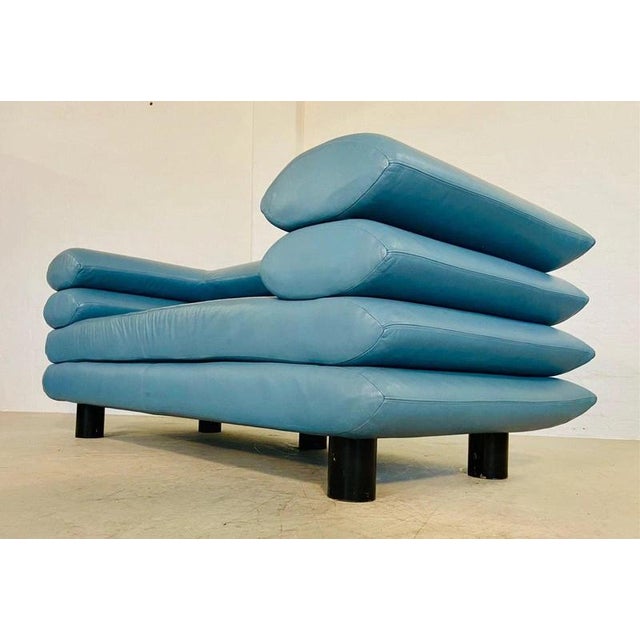 A striking vintage Swedish leather sofa dating from circa 1980, distinguished by its sculptural stacked construction and...