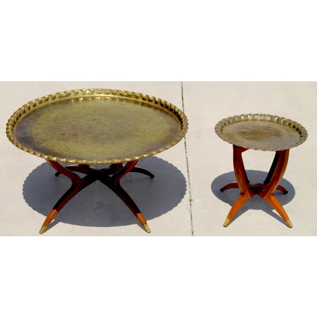 Elevate your home with this stunning vintage Moroccan brass tray table set, featuring a large coffee table and matching...