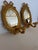 Pair of giltwood oval Carvers Guild Bow sconces with single arm for candle. 17” H x 10.75” W x 8.5” D Mirror 6.75” W x 9”...