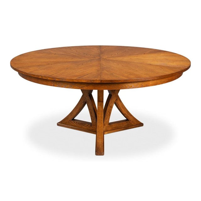 Angled supports beneath a broad circular top give the table an architectural presence in a larger dining room. Four angled...