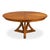 Angled supports beneath a broad circular top give the table an architectural presence in a larger dining room. Four angled...