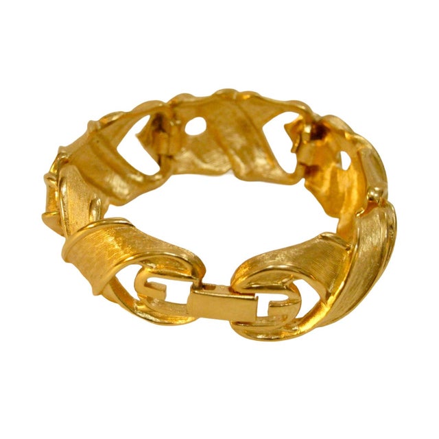 1970s Givenchy carved woven panel gold-plated fold over clasp bracelet Signed, "Givenchy, Paris, New York" From my private...