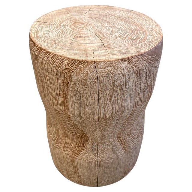 Hand carved cerused teak side table or stool with a subtle hourglass shape. Celebrating the cracks and crevices found in...