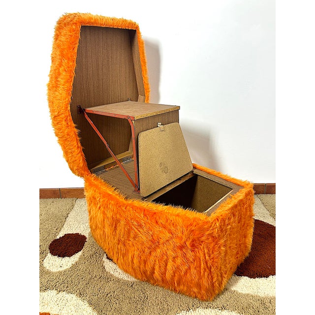 An original 1970s italian design piece with a bold character and surprising functionality. This storage ottoman, branded f...